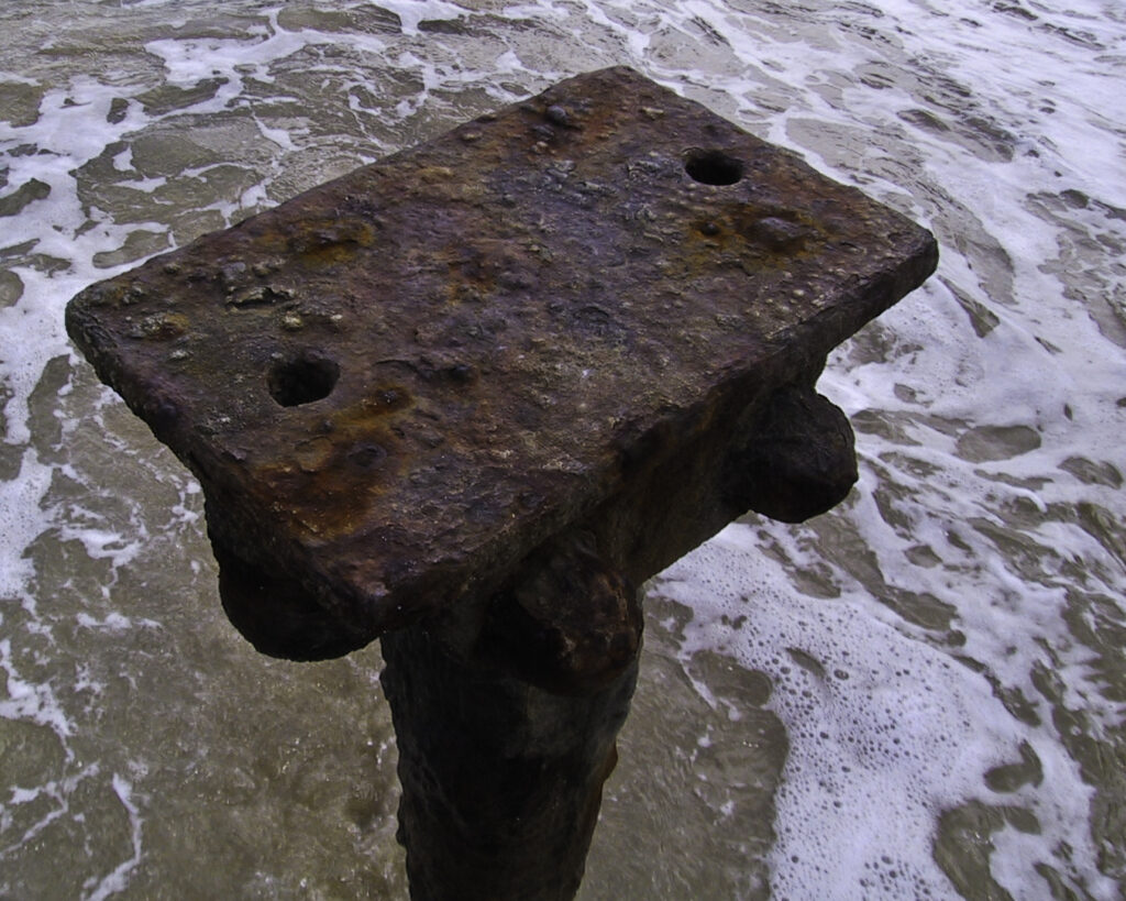 A close-up of a rusted pier post on Oahu, Hawaii