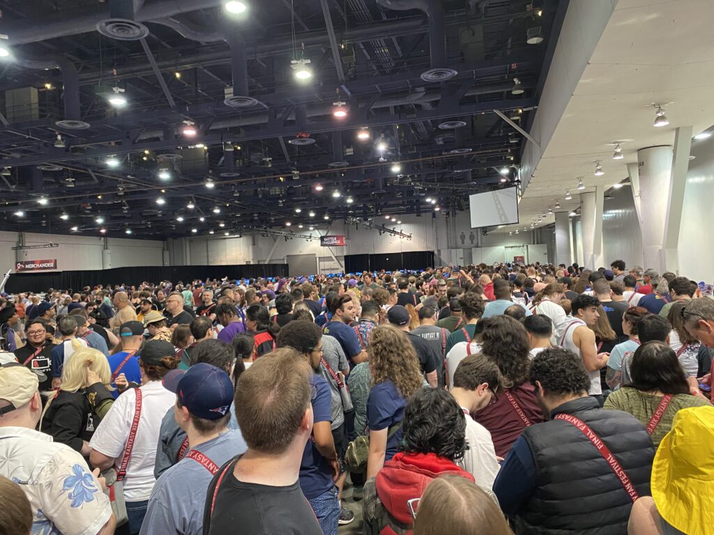 Large crowd waiting to enter the main event area for the Final Fantasy XIV Fan Fest keynote.