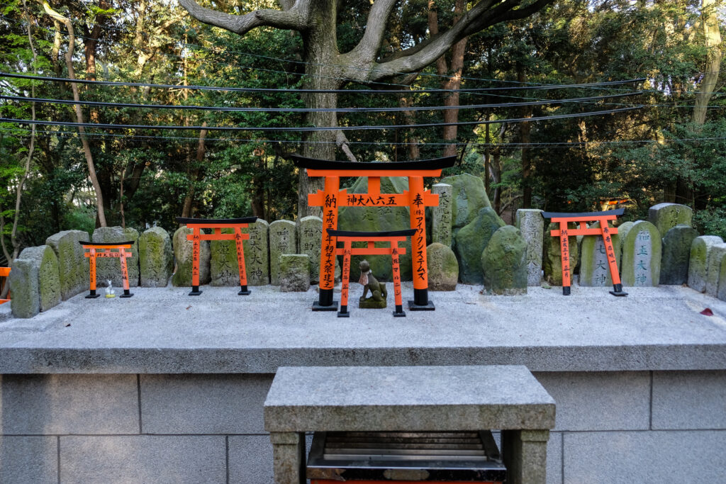 Small torii gates and statues, to honor the dead.